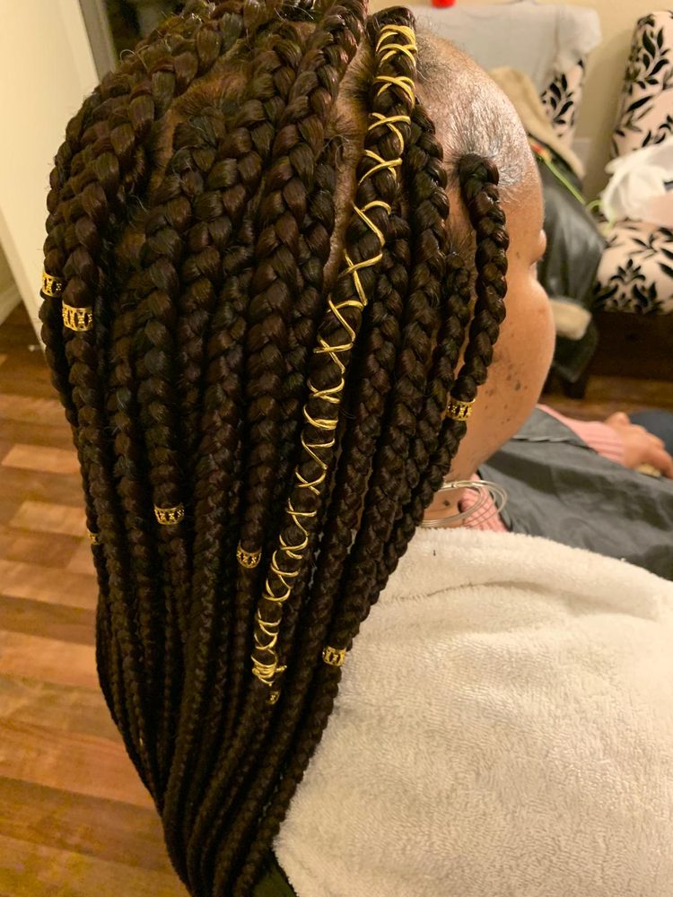 A woman with long braids in her hair