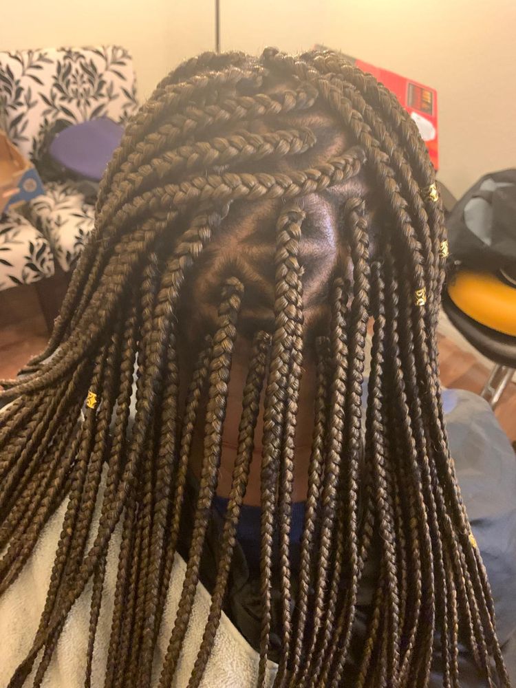 A close up of a person with long dreadlocks